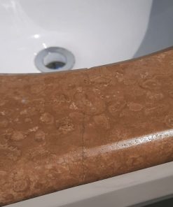 Vanitorio con cubierta mármol traventino