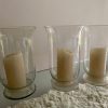 3 jarrones de vidrio con vela