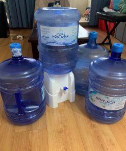 Dispensador de agua + 4 bidones 20 lt