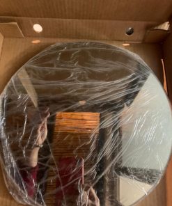 Espejo circular tono bronce marca Cerio