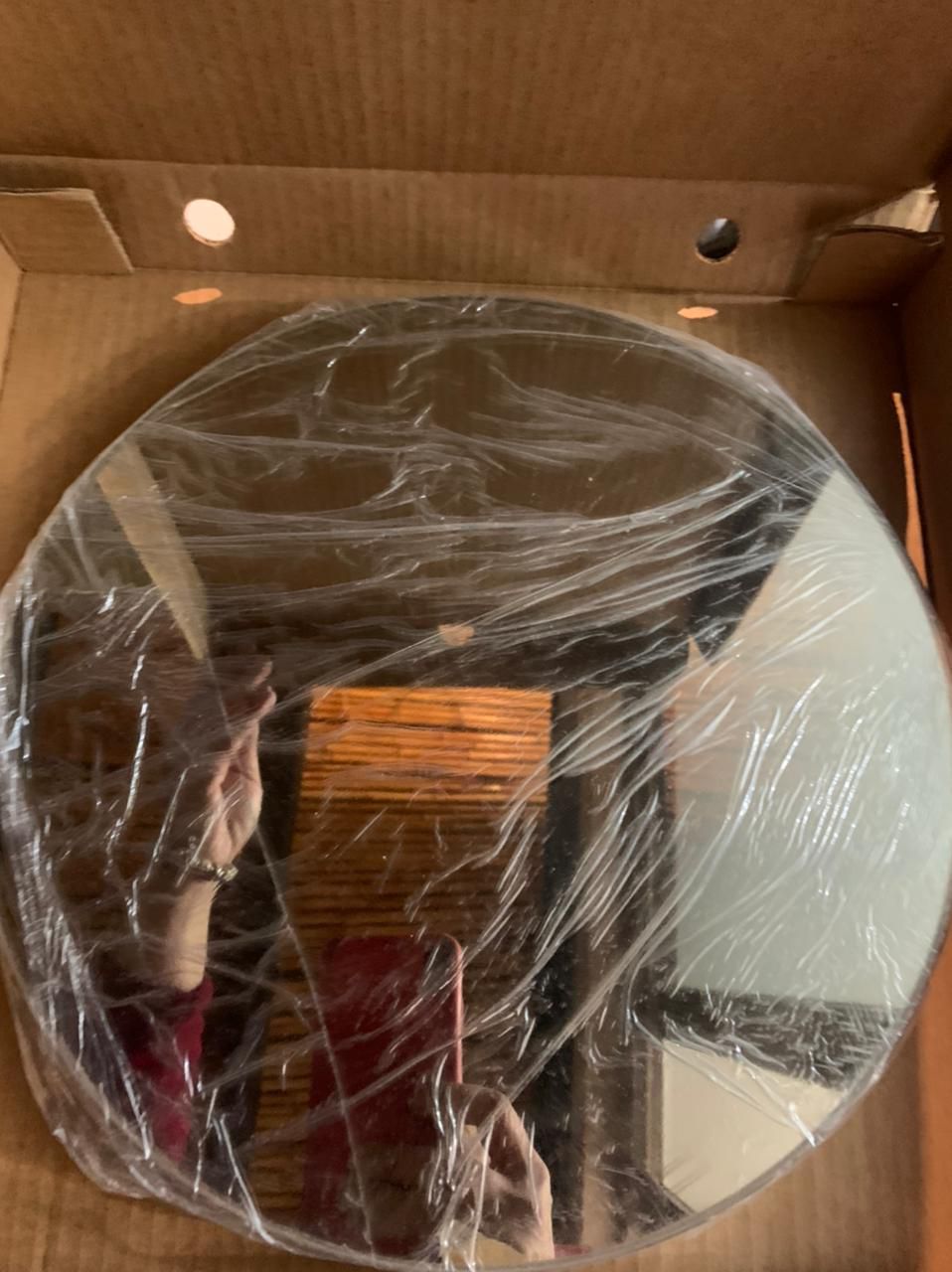 Espejo circular tono bronce marca Cerio