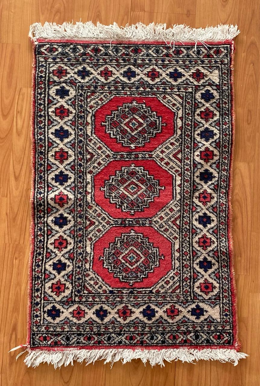 Alfombra lana fina tonos rojos