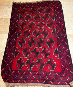 Alfombra Beloutch tonos rojos