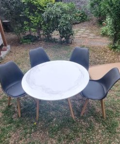 Juego comedor redondo y 4 sillas tulip negras