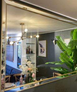 Espejo de pared borde dorado