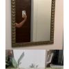 Arrimo y espejo de ónix con bronce