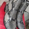 Botines de cuero animal print Bruno Rossi