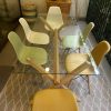 Juego de comedor vidrio con 6 sillas eames