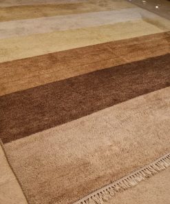 Alfombra de lana Bazhars tonos café y beige